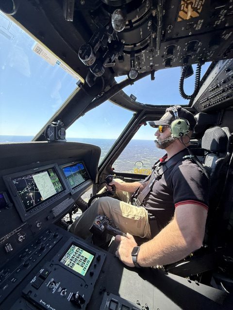 John Kinard at the controls of a UH-60 Black Hawk