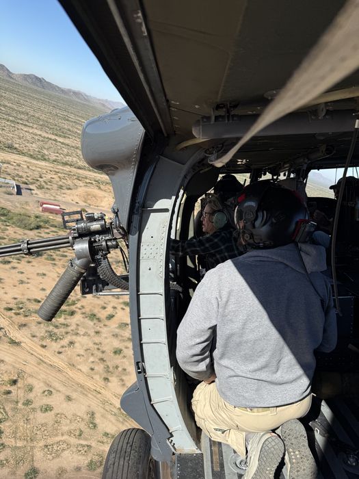 Crew in Black Hawk doorway in flight