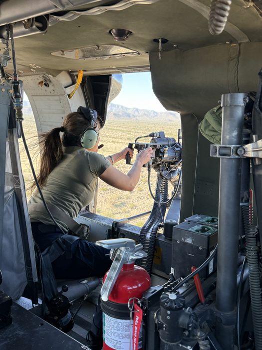 Operator at weapon system in Black Hawk doorway