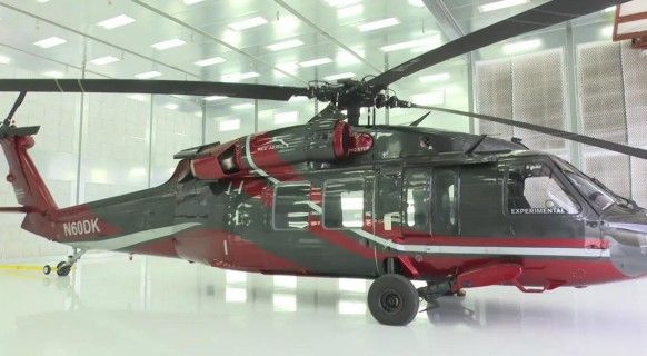 UH-60 N60DK experimental — black and red in white hangar