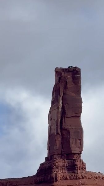 Rock spire butte at Moab UT, helicopter on top