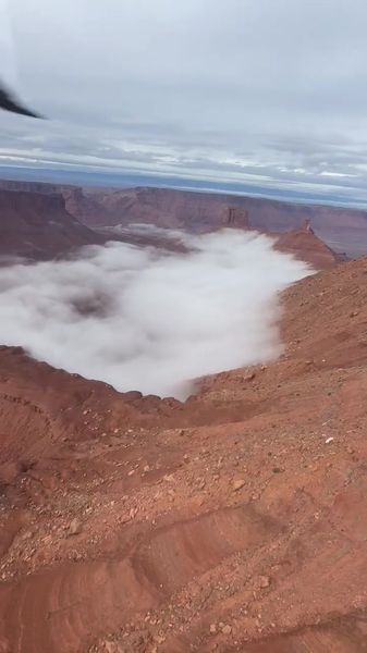 Aerial view of canyon clouds from cockpit